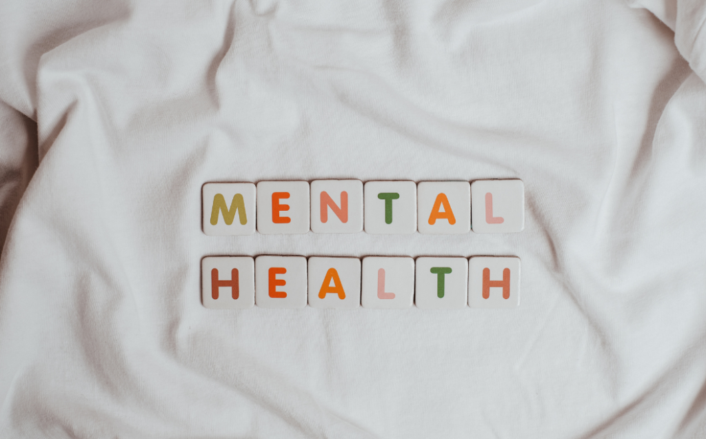 The Phrase Mental Health on a Sheet of Fabric