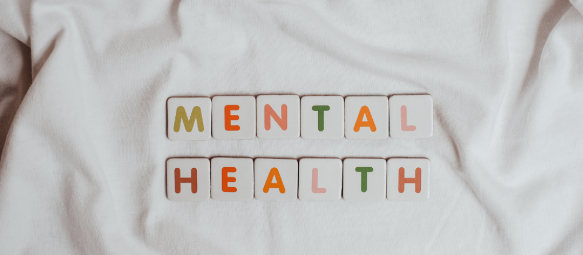 The Phrase Mental Health on a Sheet of Fabric